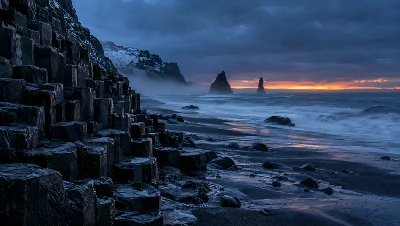 Hexagonal basalt columns on the Icelandic coast at blue hour
